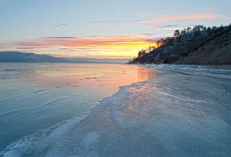 sunset over frozen lake, high dynamic range imageの写真素材