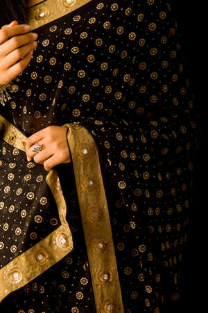 golden and black colored sari の写真素材