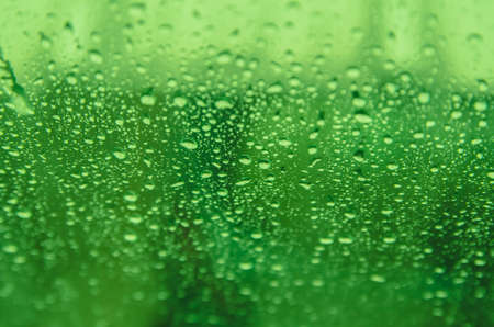 Abstract green blur background with rainsの写真素材