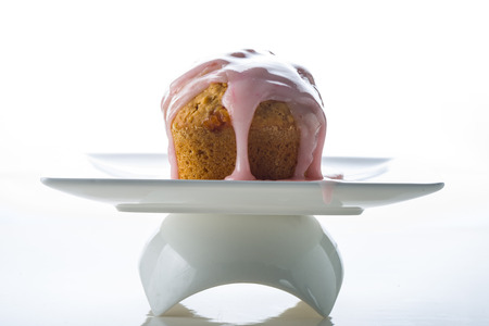 delicious small cake with strawberry icing