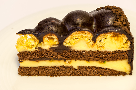 a piece of isolated vanilla and chocolate cakeの写真素材