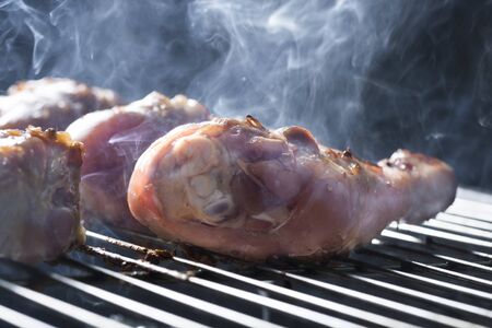 Grilled Chicken Legs On The Hot Flaming Barbecue Grillの写真素材