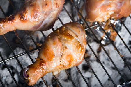 Grilled chicken Legs on the grillの写真素材