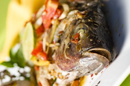 Fresch fish from berbecue with vegetables and rice