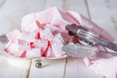 Turkish delight on white wooden table.の写真素材