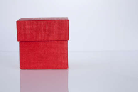 Red gift box on whiteの写真素材