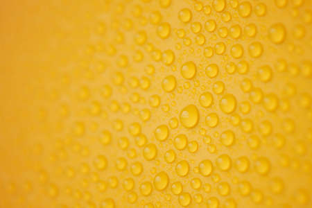 Abstract water-drops on yellowの写真素材