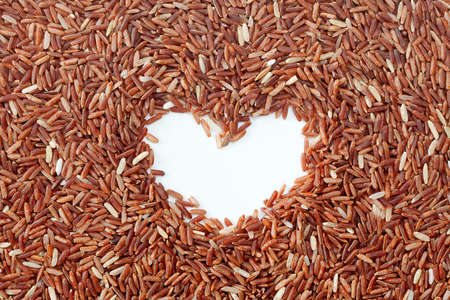 Brown rice with heart shapeの写真素材