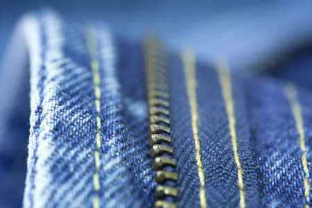 Close up of the blue jeans zipperの写真素材