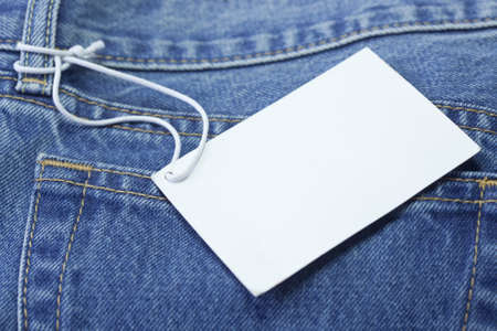 Blue jeans detail with white tagの写真素材