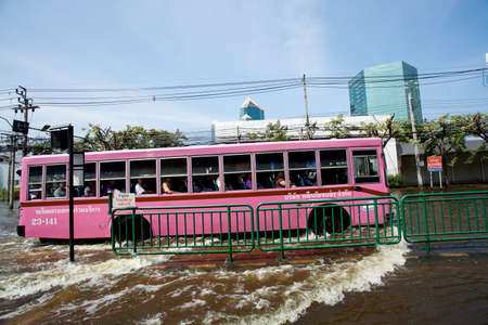 Bangkok, Thailand - November 9, 2011 - A city bus makes its way through a major flooded street in the Phahonyothin roadのeditorial素材