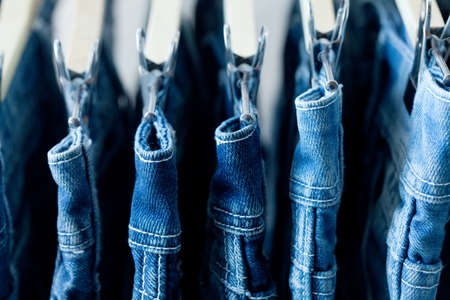 Row of hanged blue jeans