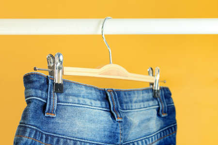 Row of hanged blue jeans