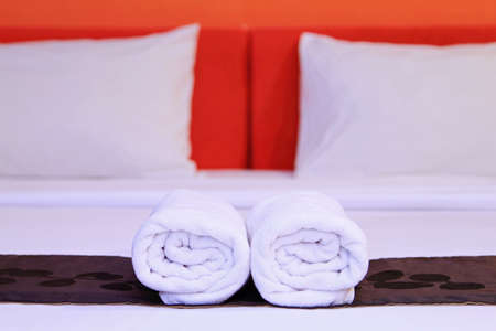 White clean towels on the hotel bedの写真素材
