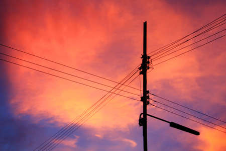 Sunset in Thailand and electricity poleの写真素材