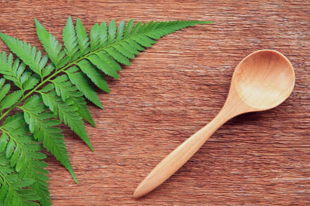 Wooden spoon on tableの写真素材
