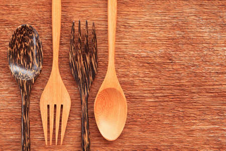 Wooden spoon and fork on tableの写真素材