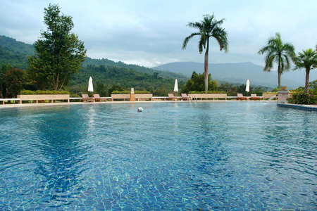 Young girl in the blue water pool, Thailandのeditorial素材