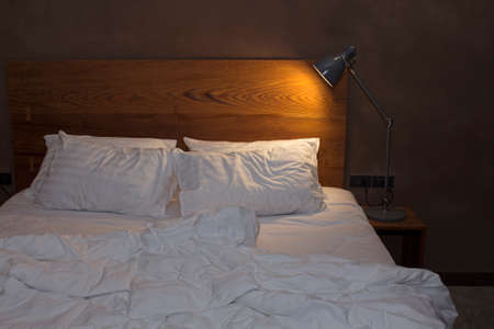 View of bedroom with desk lampの写真素材