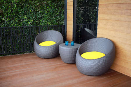 Modern furniture plastic wicker chairs on the terreceの写真素材