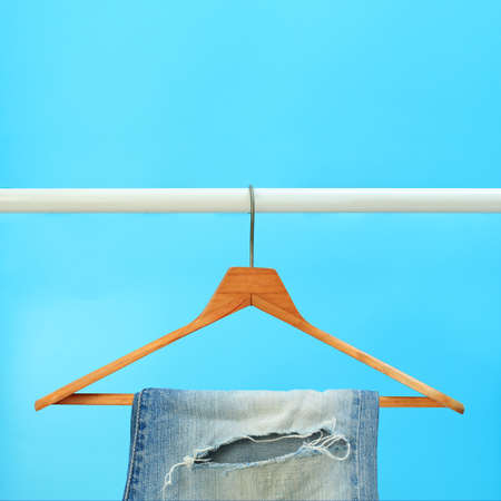 Row of hanged blue jeansの写真素材