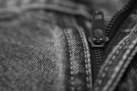 Close up of the blue jeans zipperの写真素材