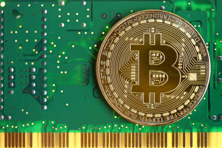 Bitcoin with green circuit board