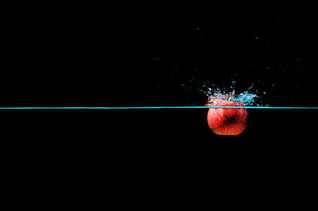 Red apple water splash.の写真素材