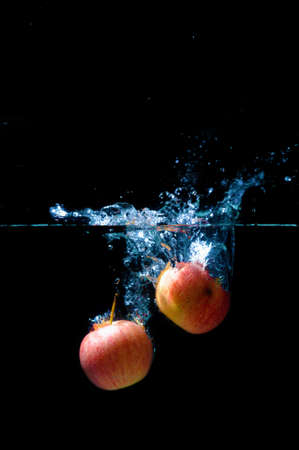 Red apple water splash.の写真素材