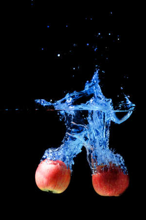 Red apple water splash.の写真素材