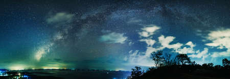 Landscape with milky way over lake.  Night sky with stars.の写真素材