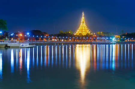 Beautiful thailand temple over bueng kaen nakhon lake in twilight at khonkaen, Thailandの写真素材