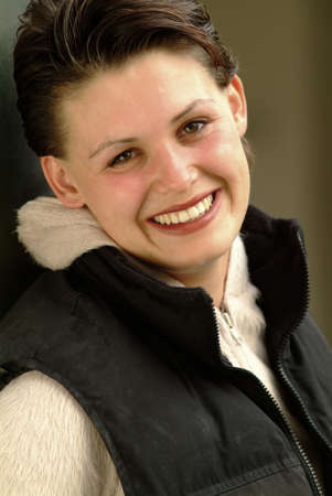 portrait of a smiling woman looks at you