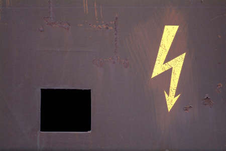 a drawn electricity board on a rusty metalの写真素材