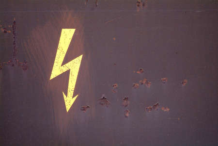 a drawn electricity board on a rusty metalの写真素材