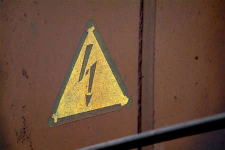 a drawn electricity board on a rusty metalの写真素材