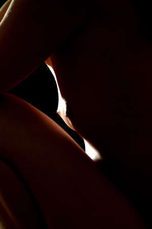 female breast in spotlightの写真素材