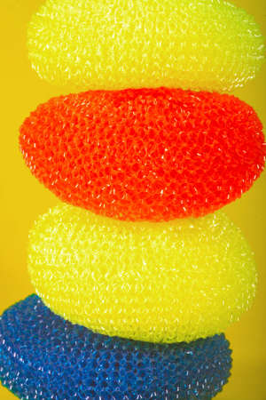 four pot cleaner in blue, yellow and redの写真素材