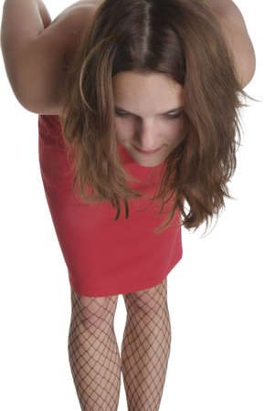 a young woman in red clothes takes a bow lowの写真素材