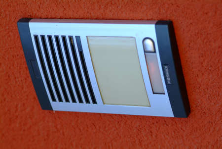 interphone system with doorbell and brown background