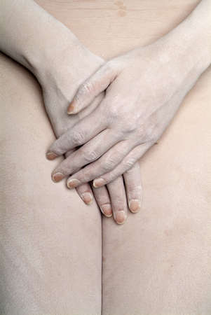 two hands in front of the female shame with white masceradeの写真素材