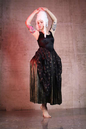 woman with white peruke and black costumeの写真素材