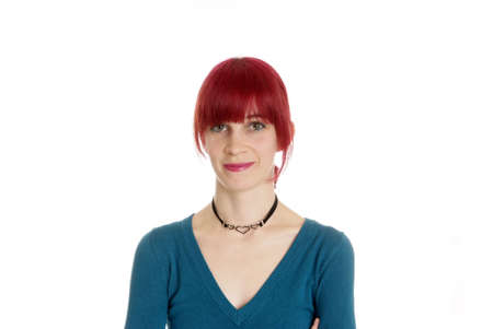 a friendly woman with red hair smiles