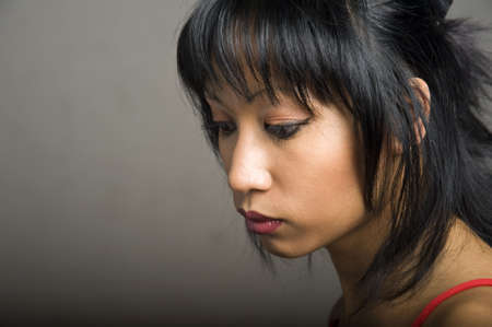 portrait of a young pretty asian woman with red lipsの写真素材
