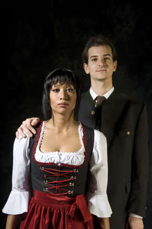 young woman and man in Dirndl and costumeの写真素材