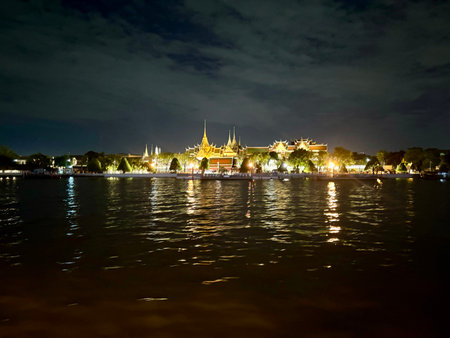 Bangkok Grand Palace at night with reflection in the river, Thailandの写真素材