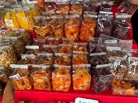 Dried fruits and nuts in plastic bags for sale at a street marketの写真素材