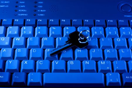 Key rests upon computer keyboard 