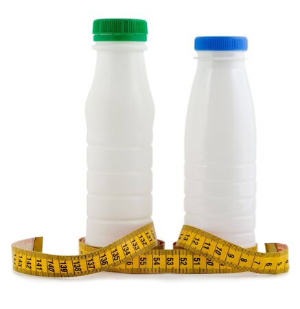 bottle milk and yogurt with tape measureの写真素材