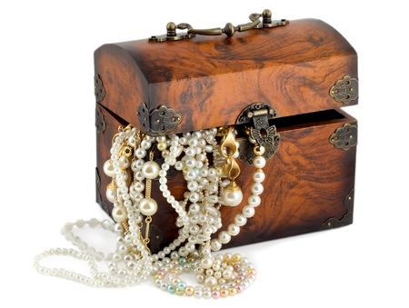 Treasure chest with pearl earrings , jewellery border , golden chains bracelets pearl isolated on white backgroundの写真素材